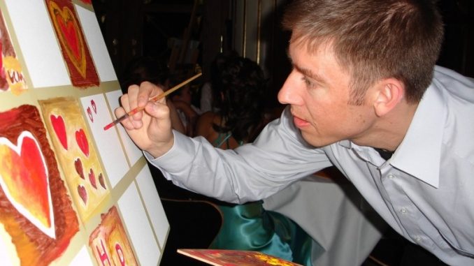 man-painiting-hearts