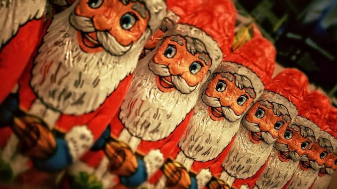 row-of-santa-claus-figurines-made-of-chocolate
