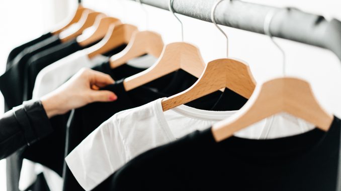 woman-choosing-t-shirts-during-clothing-shopping-at-apparel-store-2-picjumbo-com